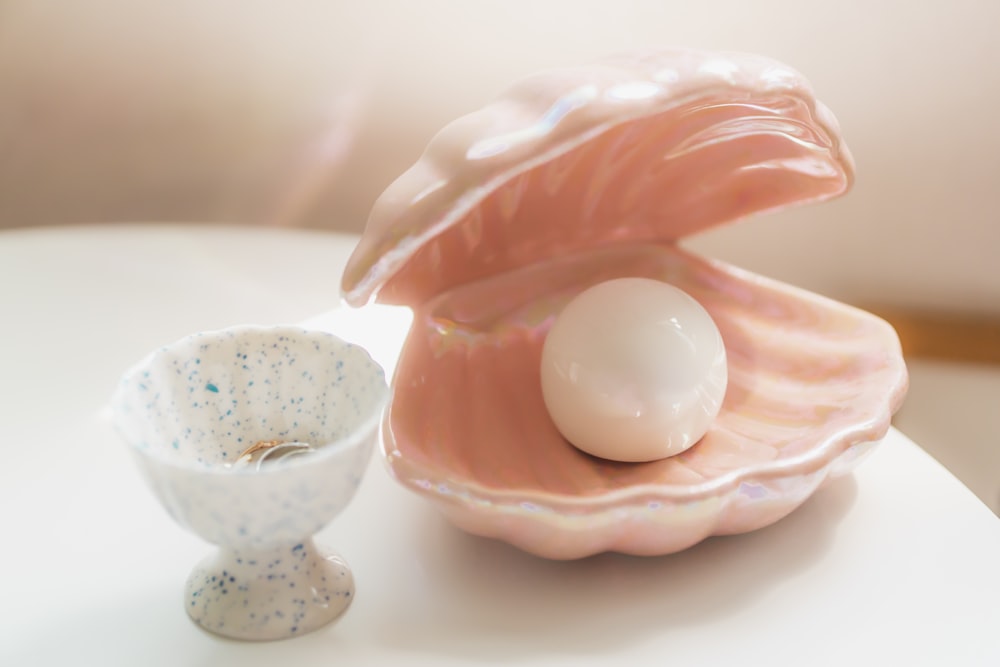 pink and white ceramic egg figurine