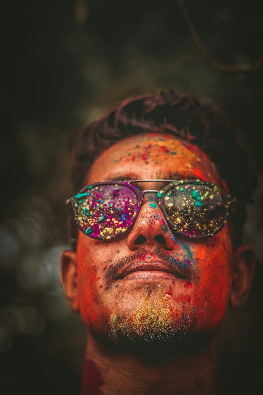 man in black sunglasses with brown hair