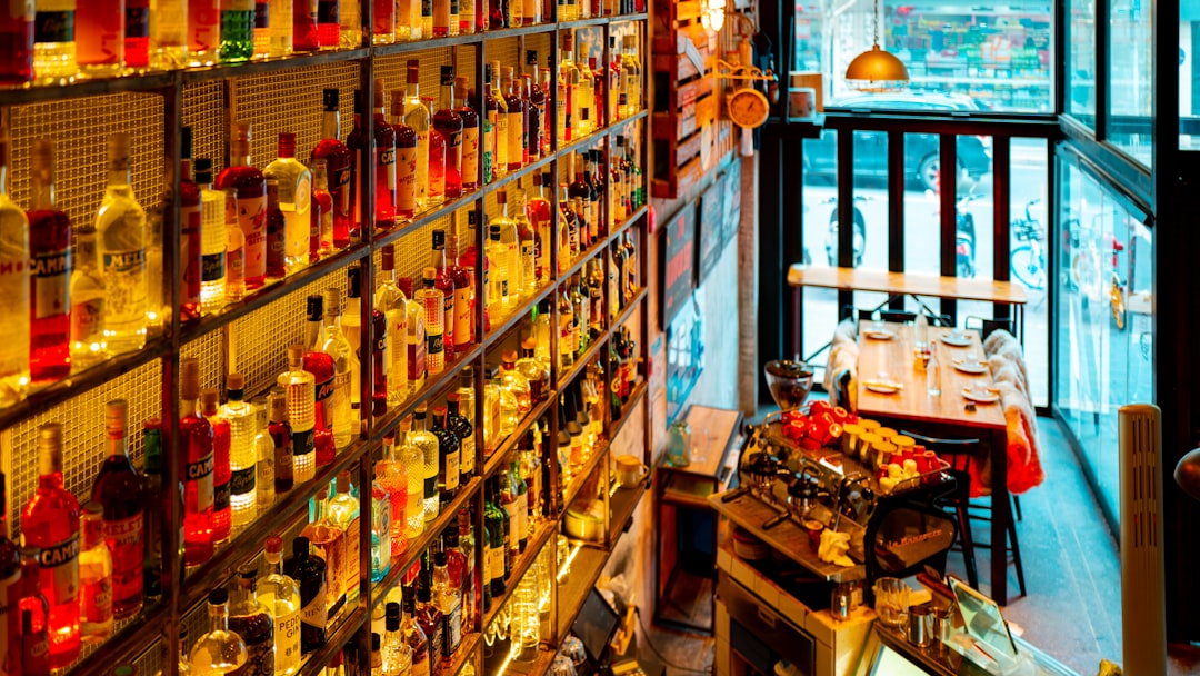 brown wooden shelf with bottles and boxes