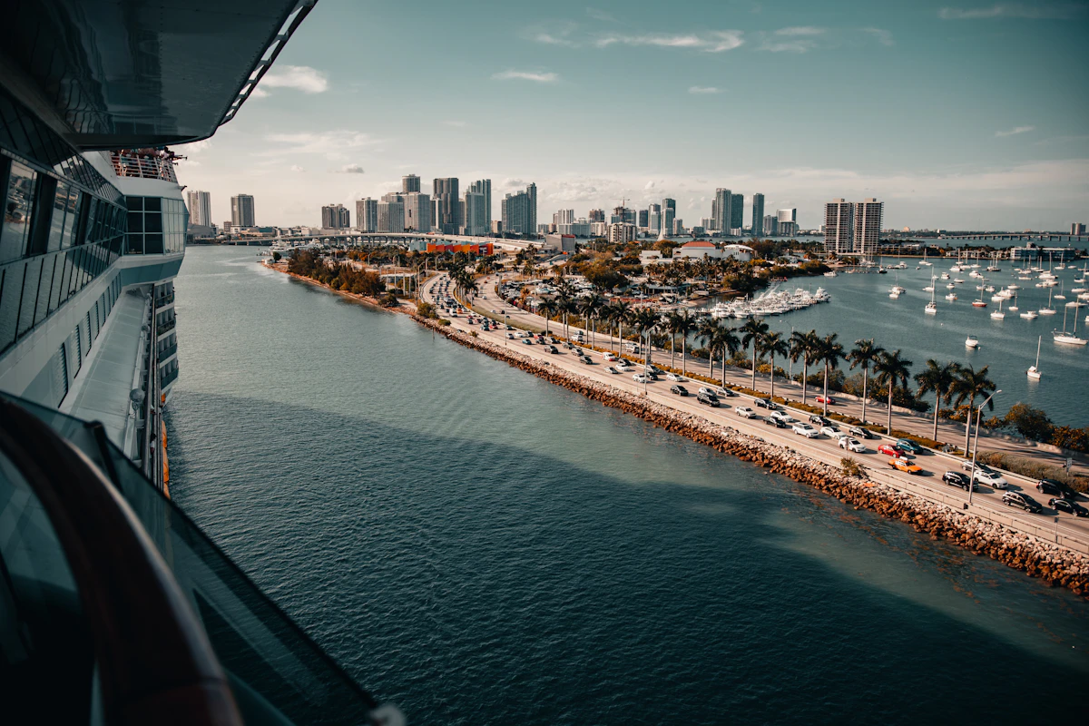A large cruise ship berthed at a port terminal
