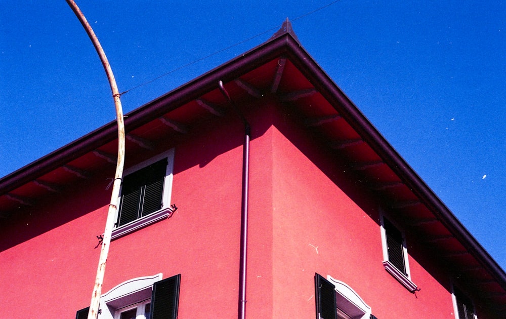 red and white concrete building under blue sky during daytime