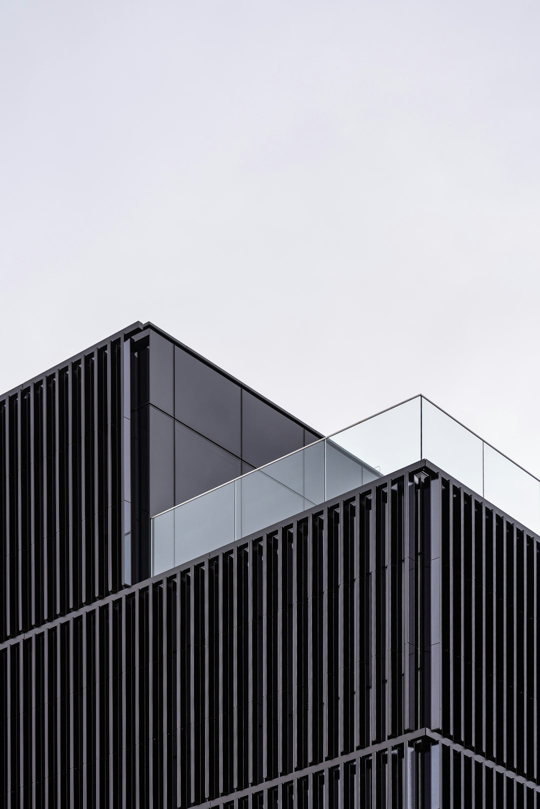 black steel gate under white sky during daytime