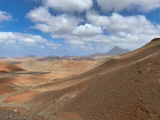 brown mountain under blue sky during daytime in São Vicente Cape Verde