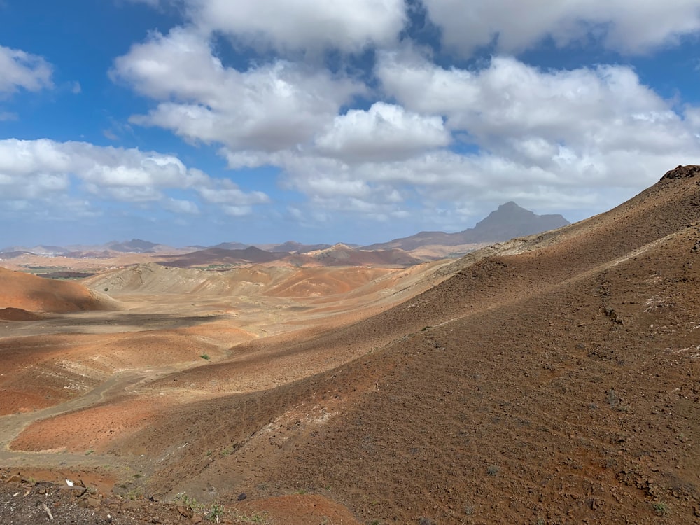 brown mountain under blue sky during daytime