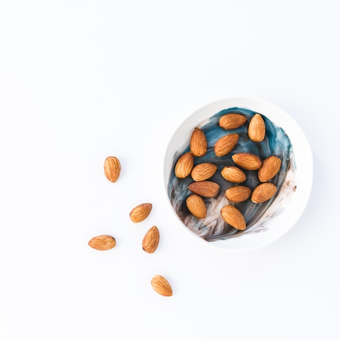 brown and white round food on white ceramic bowl