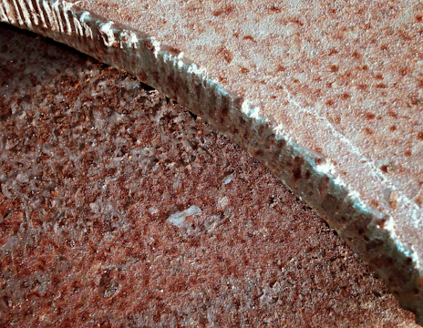 Close-up of textured surfaces merging digital and physical layers.