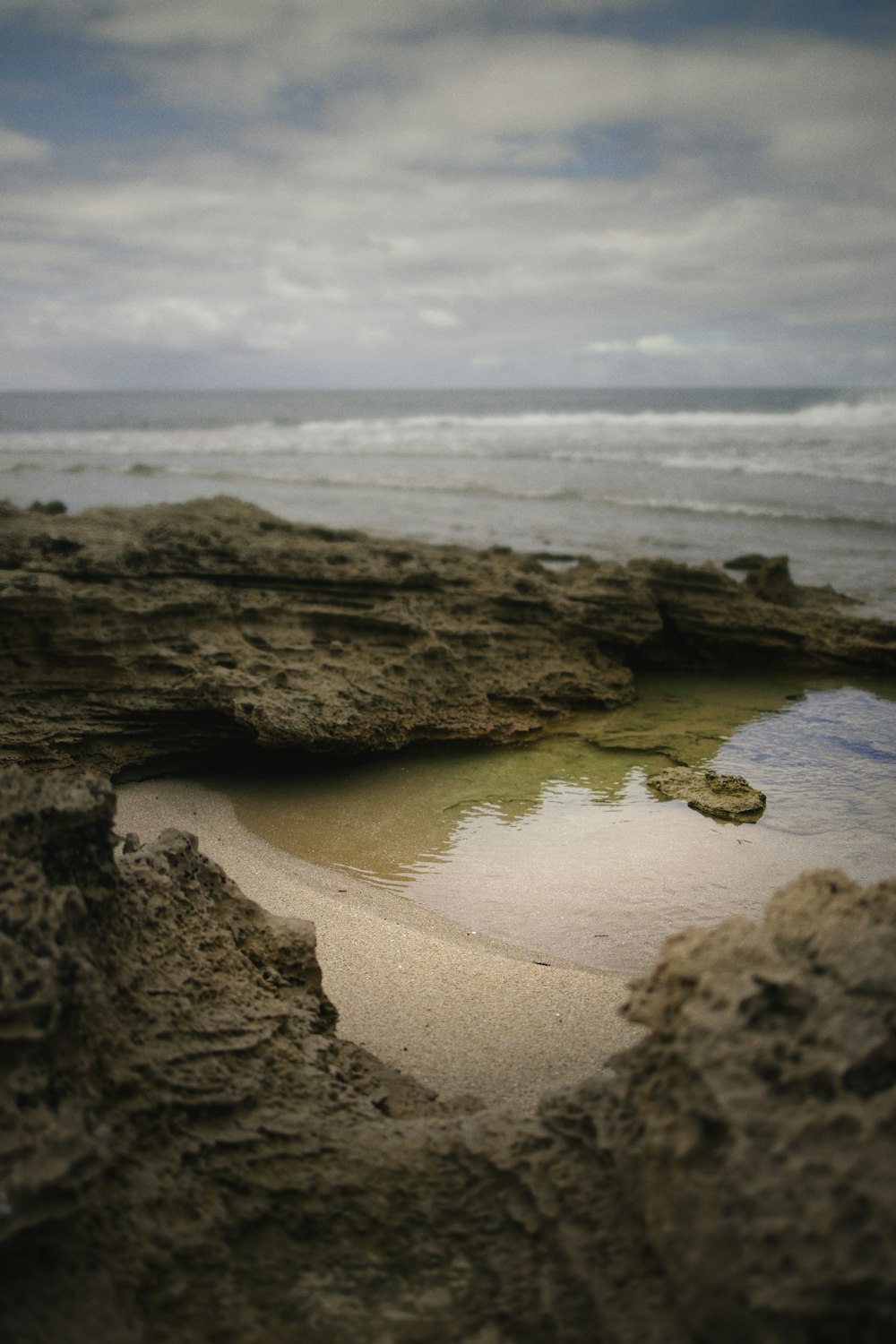 brown rock formation on seashore during daytime