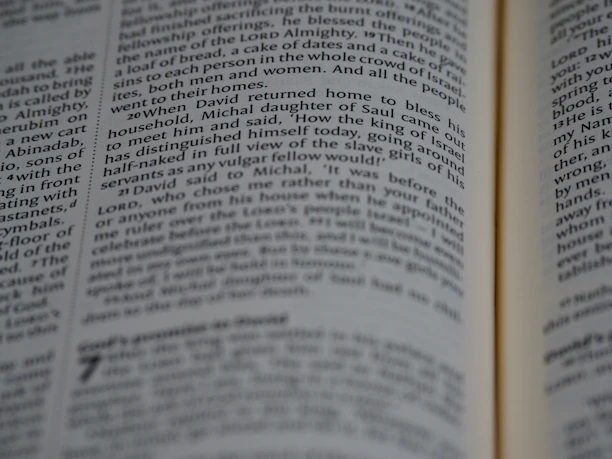 A close-up of an open book with diverse language text visible on its pages.
