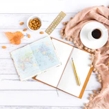 Close-up of an inspiring journal and pen lying open, symbolizing personal growth and new beginnings.