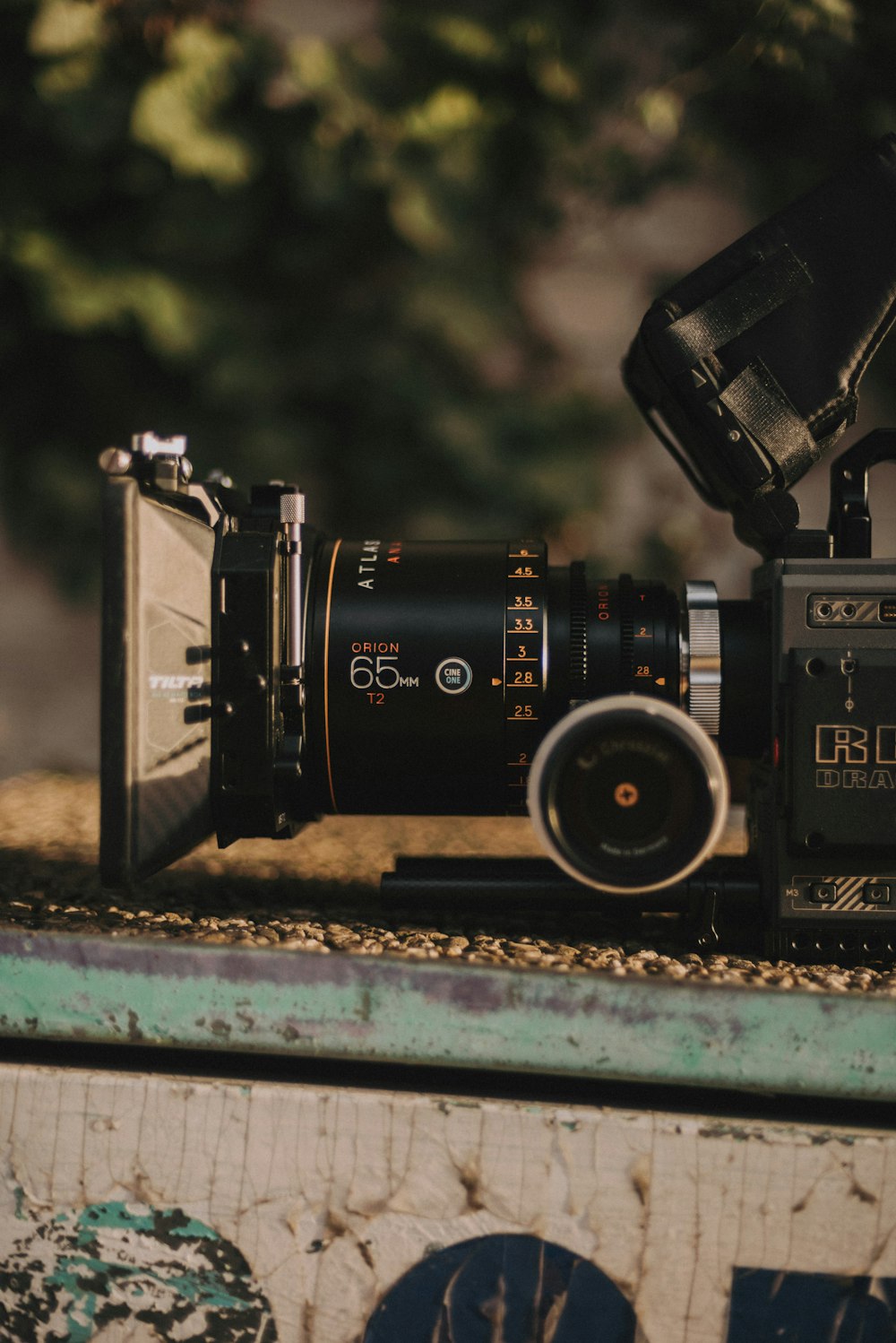 black nikon dslr camera on blue and white wooden table