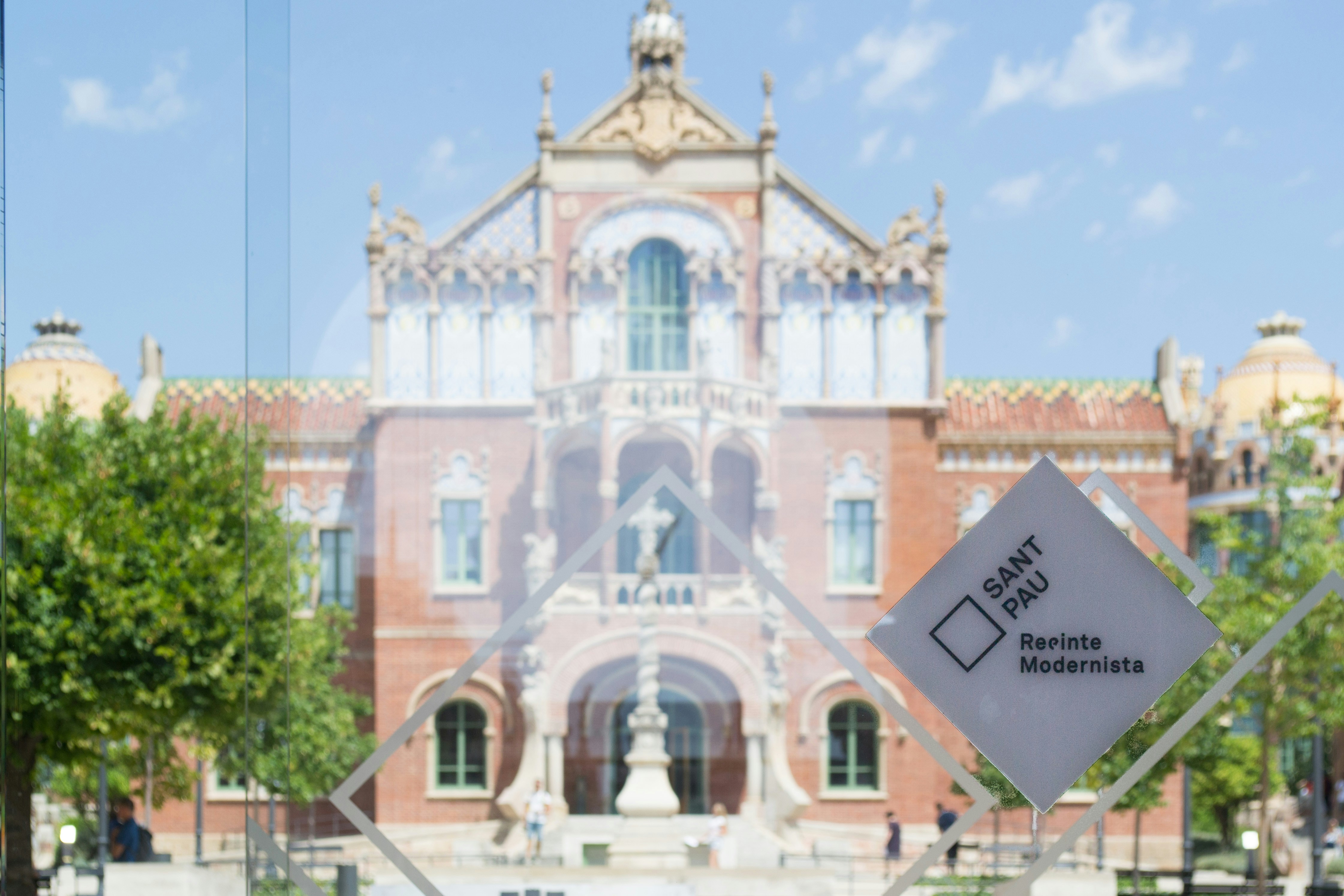 brown and white concrete building under blue sky during daytime