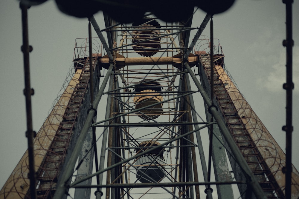 low angle photography of brown metal tower