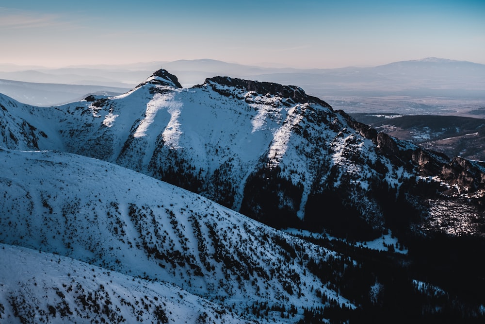 snow covered mountain during daytime