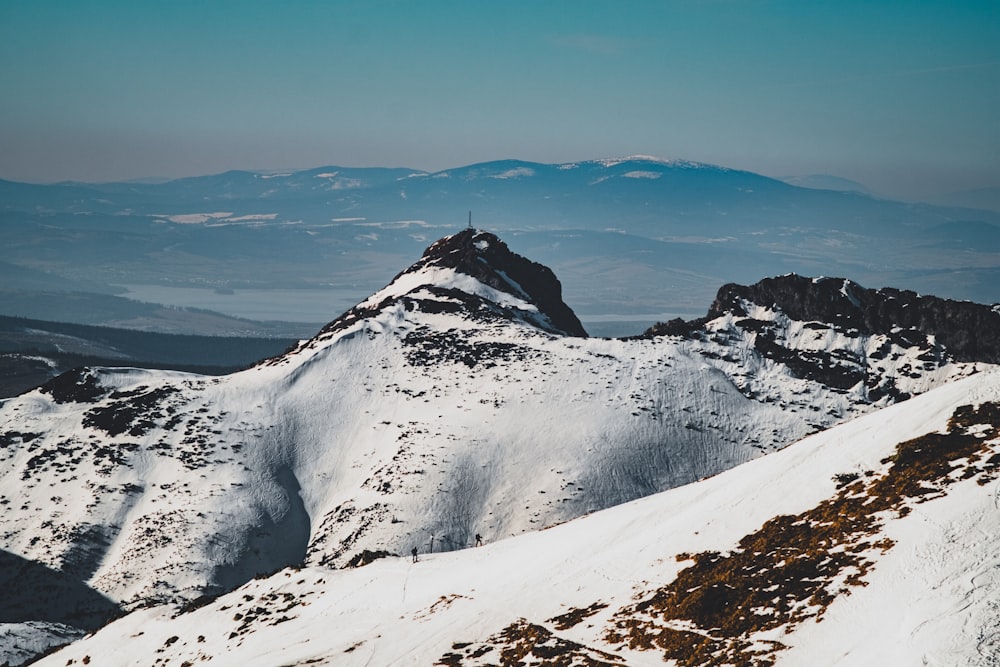 snow covered mountain under blue sky during daytime