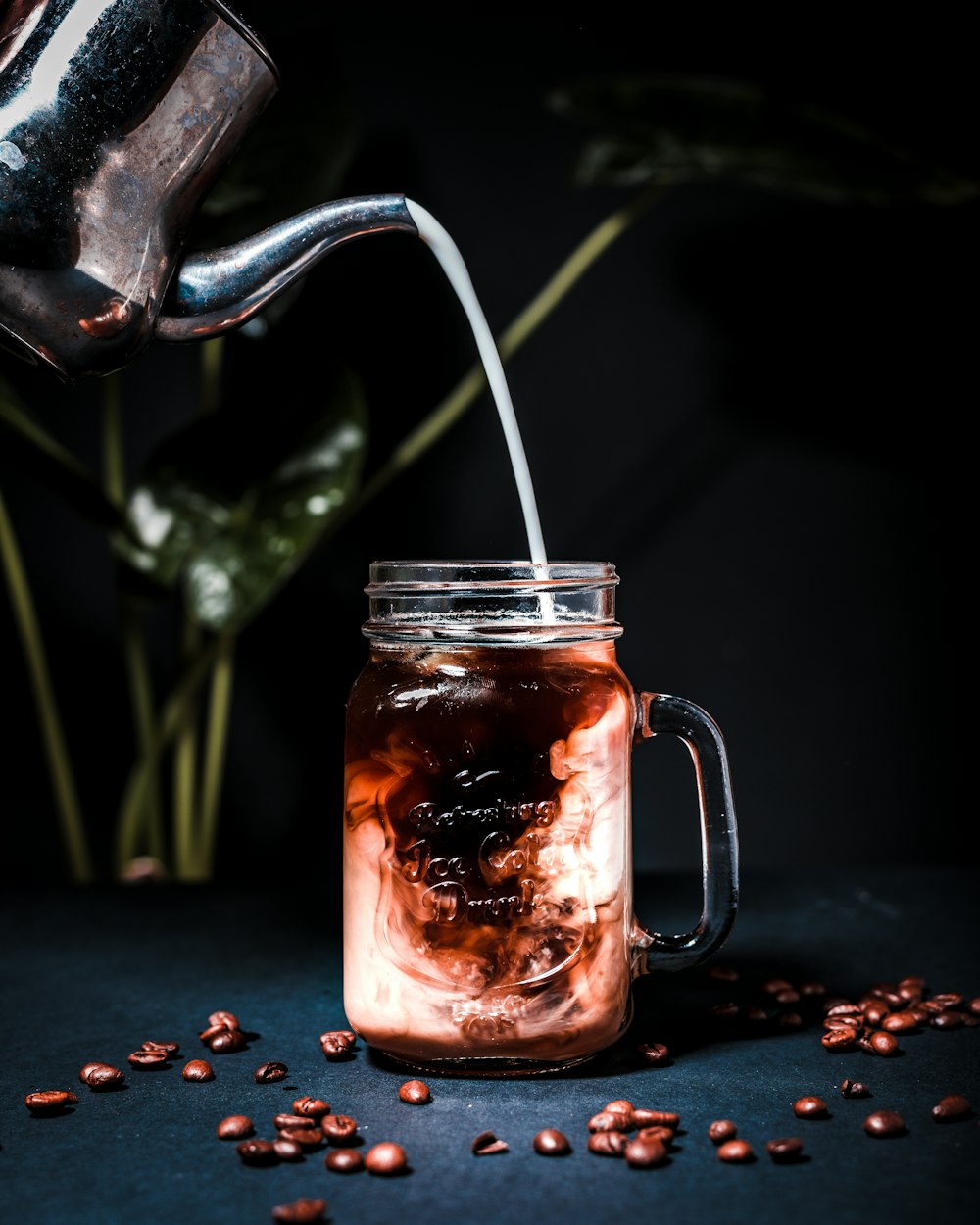 clear glass jar with white plastic straw