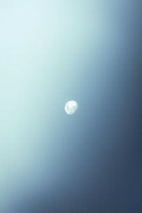 Minimalist blue moon icon on a clean white background