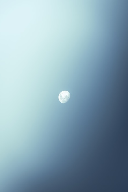 Minimalist blue moon icon on a clean white background