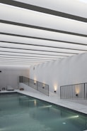 A luxurious swimming pool design in a minimalist style.