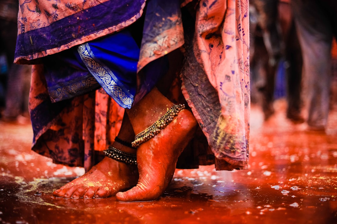 person wearing brown leather boots