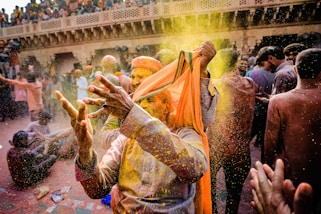 man in yellow and brown traditional dress