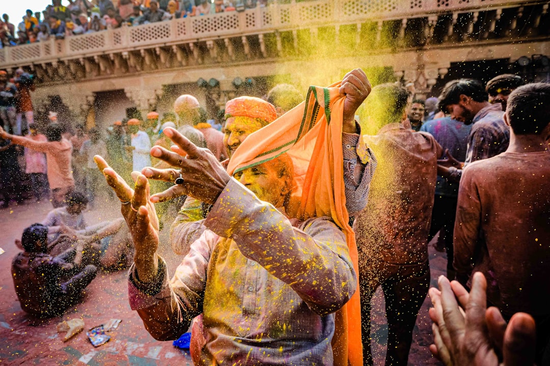 man in yellow and brown traditional dress, holi festival 2020