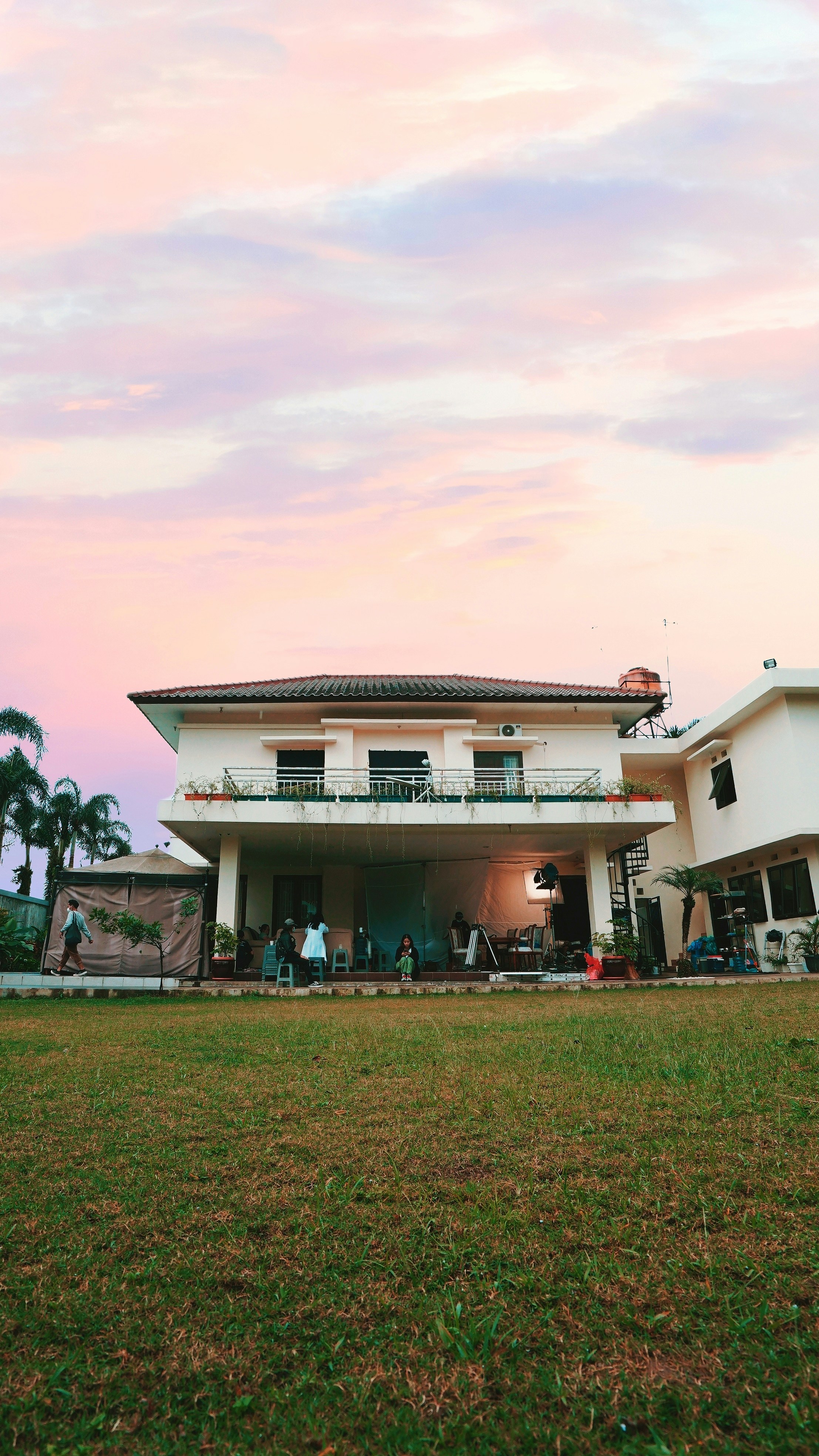 white concrete building near green grass field during daytime
