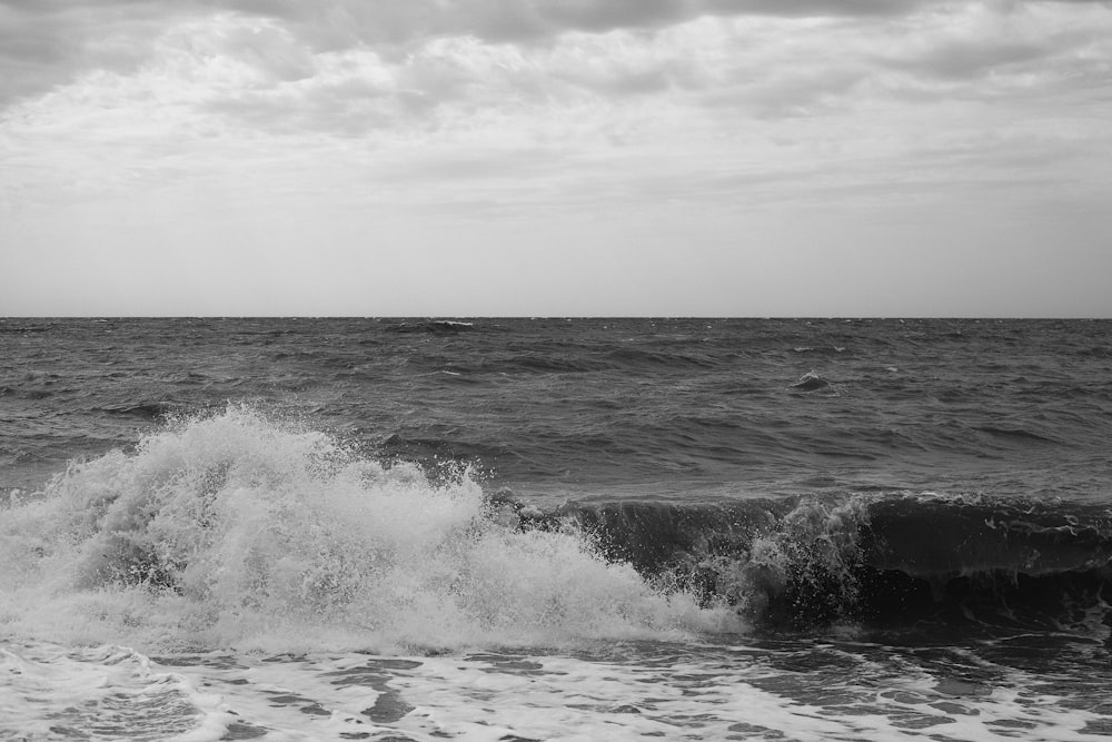 ocean waves crashing on shore during daytime