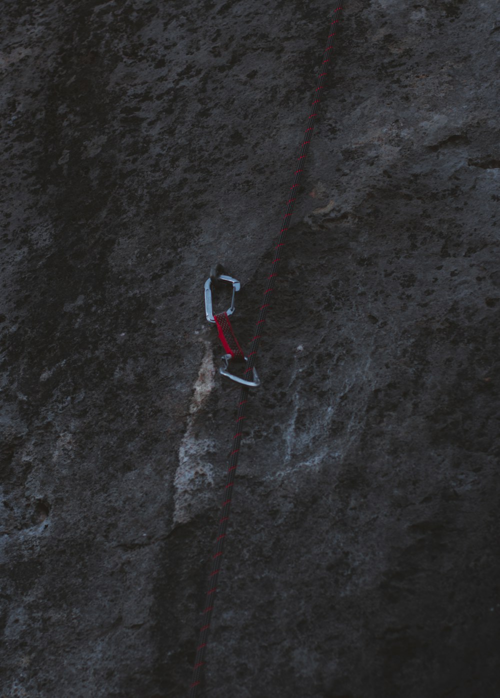 red and black rope on gray concrete floor