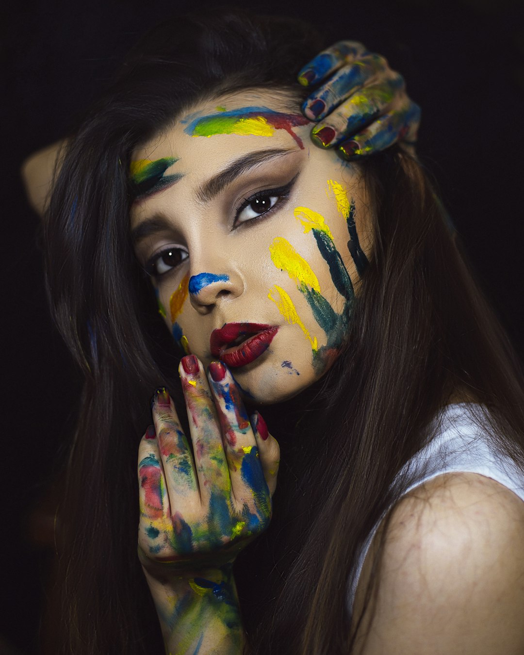 woman with red blue and yellow face paint