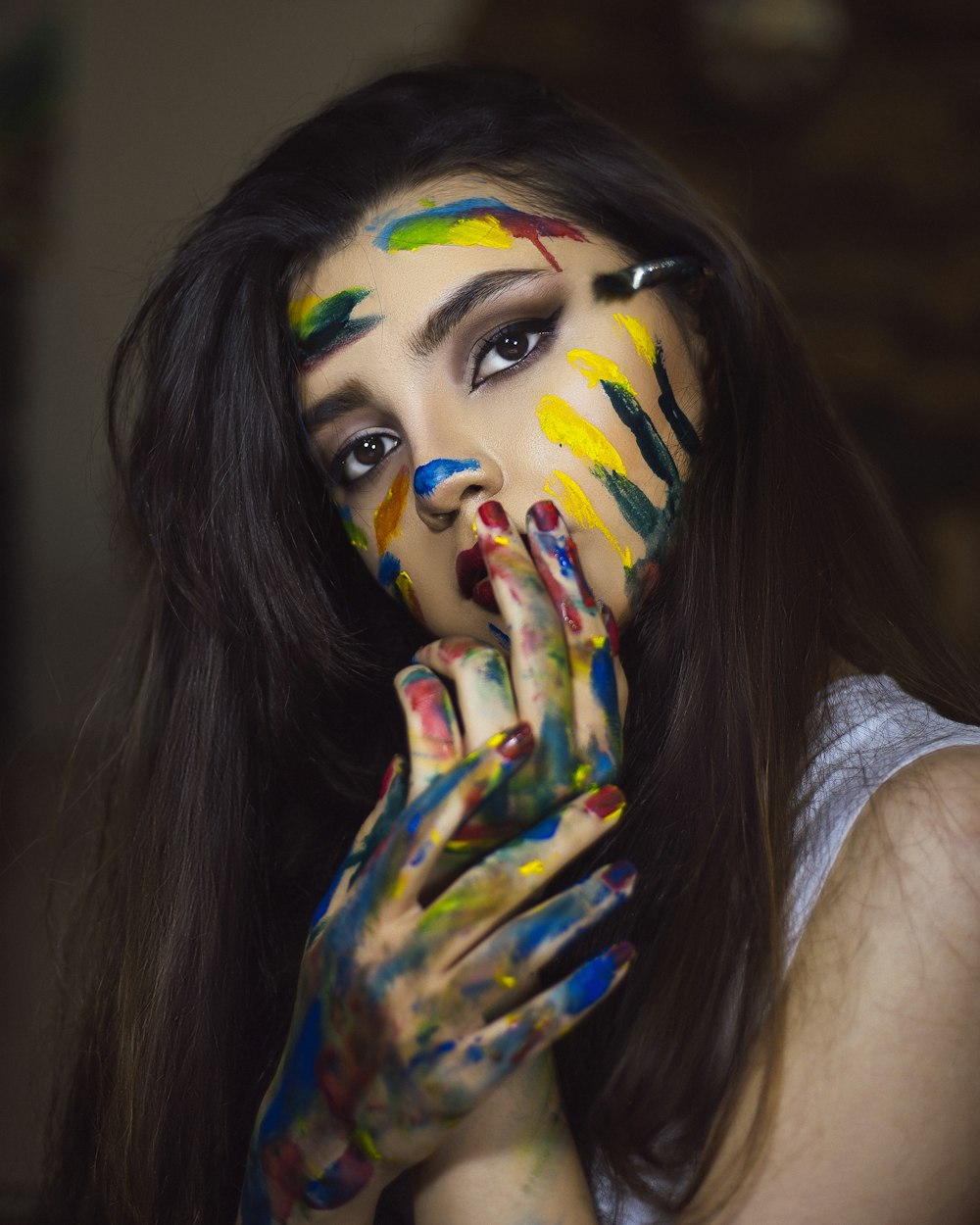 woman in white tank top with face paint