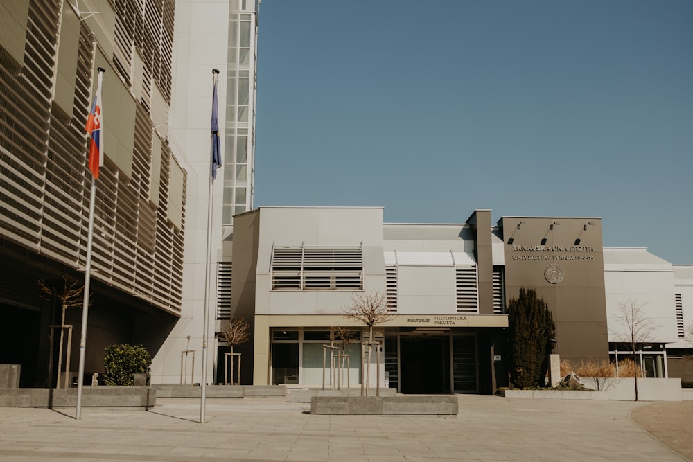 white concrete building near green trees during daytime