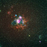 A vibrant nebula glowing with swirling colors of red and purple against a starry backdrop.