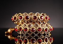 gold and red beaded accessory