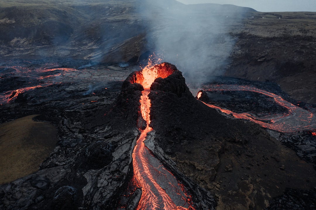 black and brown rock formation, Erupting Volcano in Iceland