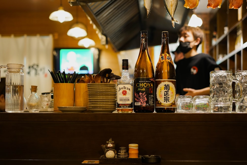 brown glass bottle on brown wooden table