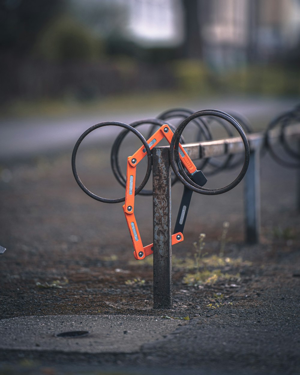 black and orange metal frame on brown soil