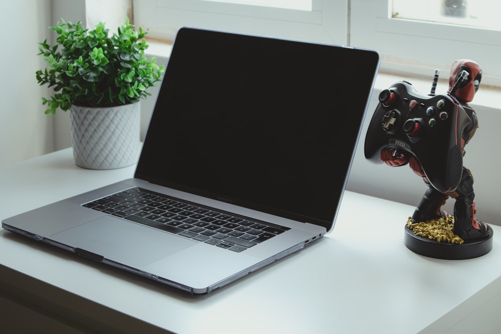 macbook pro on white table