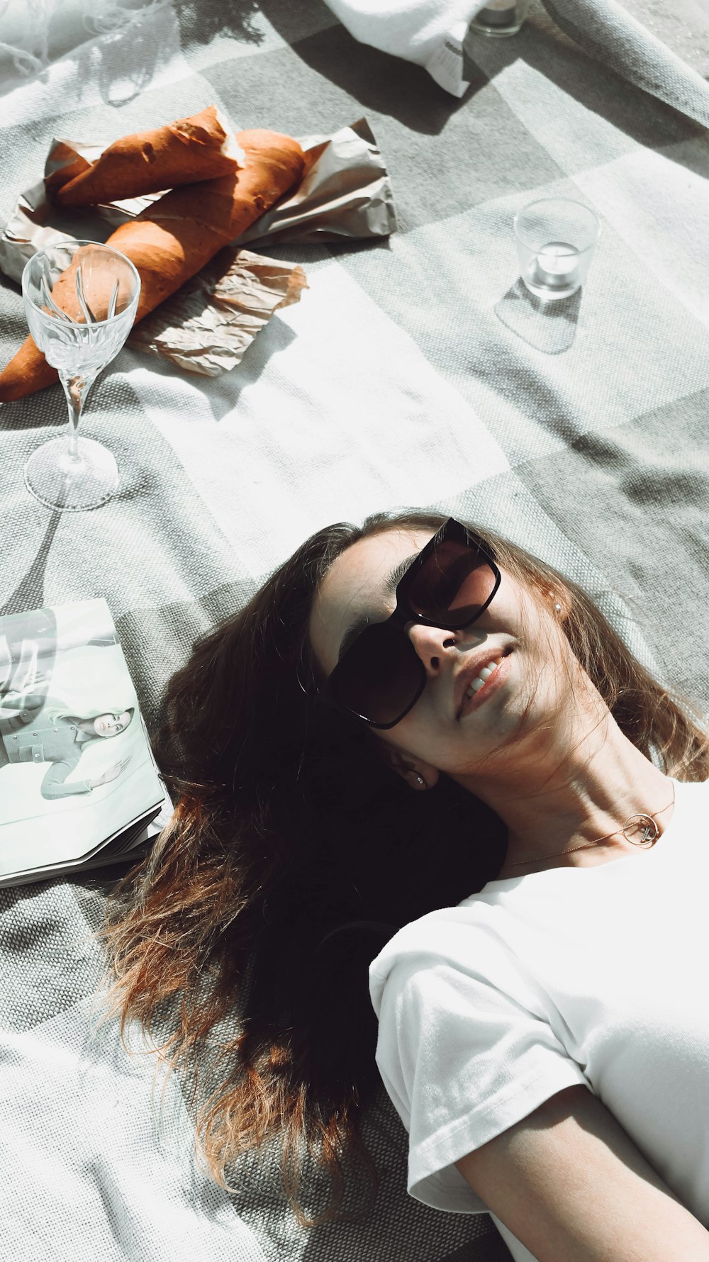 woman in white shirt wearing black sunglasses