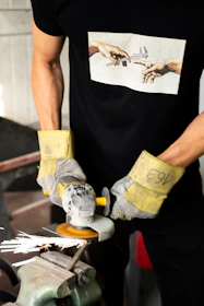 person in black tank top and blue denim jeans with yellow and white shoes