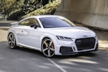 white audi tt parked near brown wall on premium tyres sold at our lagos tire shop