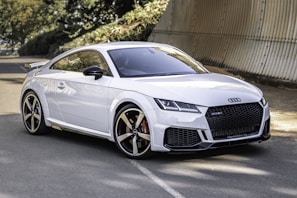 white audi tt parked near brown wall on premium tyres sold at our lagos tire shop