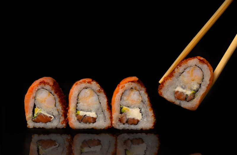 A sushi platter styled tableside with sauces