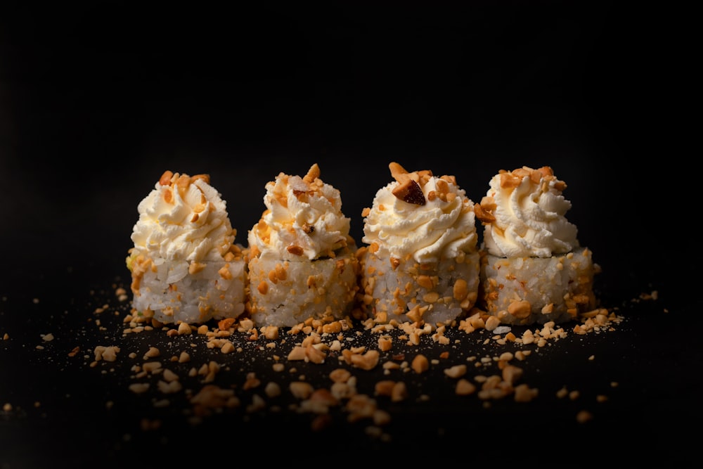 white and brown cake on black surface