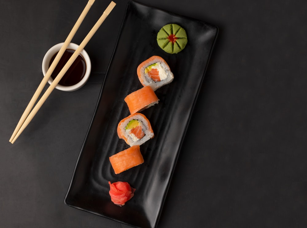 sushi on black rectangular plate