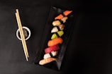 sushi on black square plate