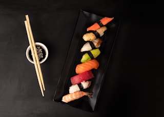 sushi on black square plate