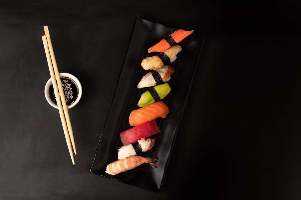 sushi on black square plate