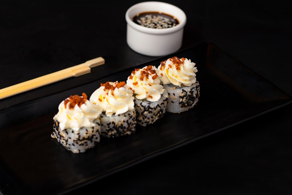 sushi on black rectangular tray