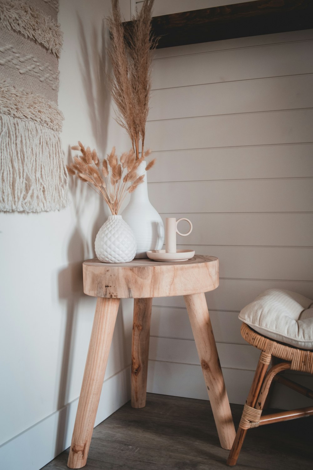 white ceramic vase on brown wooden seat