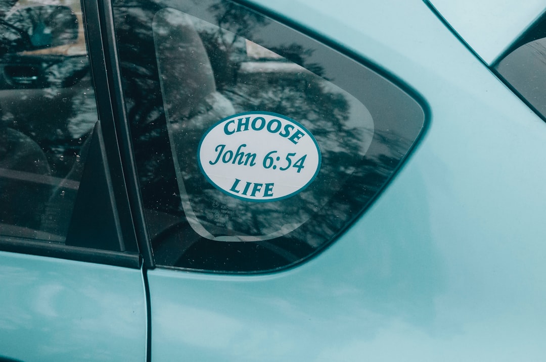 blue car with white and black license plate